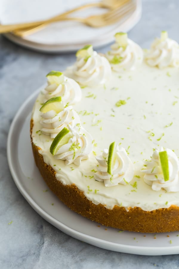 This No Bake Key Lime Cheesecake is so easy to make! It's light and fresh and made with fresh lime juice and real cream. It's got the perfect combination of creamy, tangy and sweet! #cheesecake #recipe #dessert no bake key lime cheesecake whole