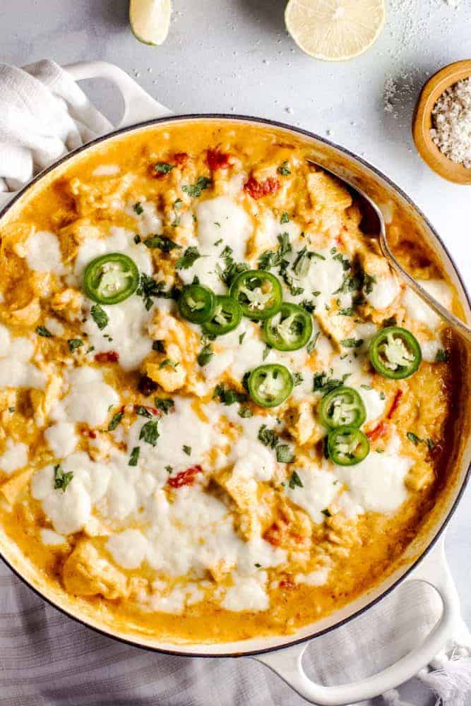 This Queso Chicken Skillet has the potential to become your families new favorite weeknight dinner. Creamy queso melted together with tender chicken, diced chilis and tomatoes, all mixed into tasty yellow rice create the perfect cheesy dinner. Areal view of a Queso Chicken Skillet