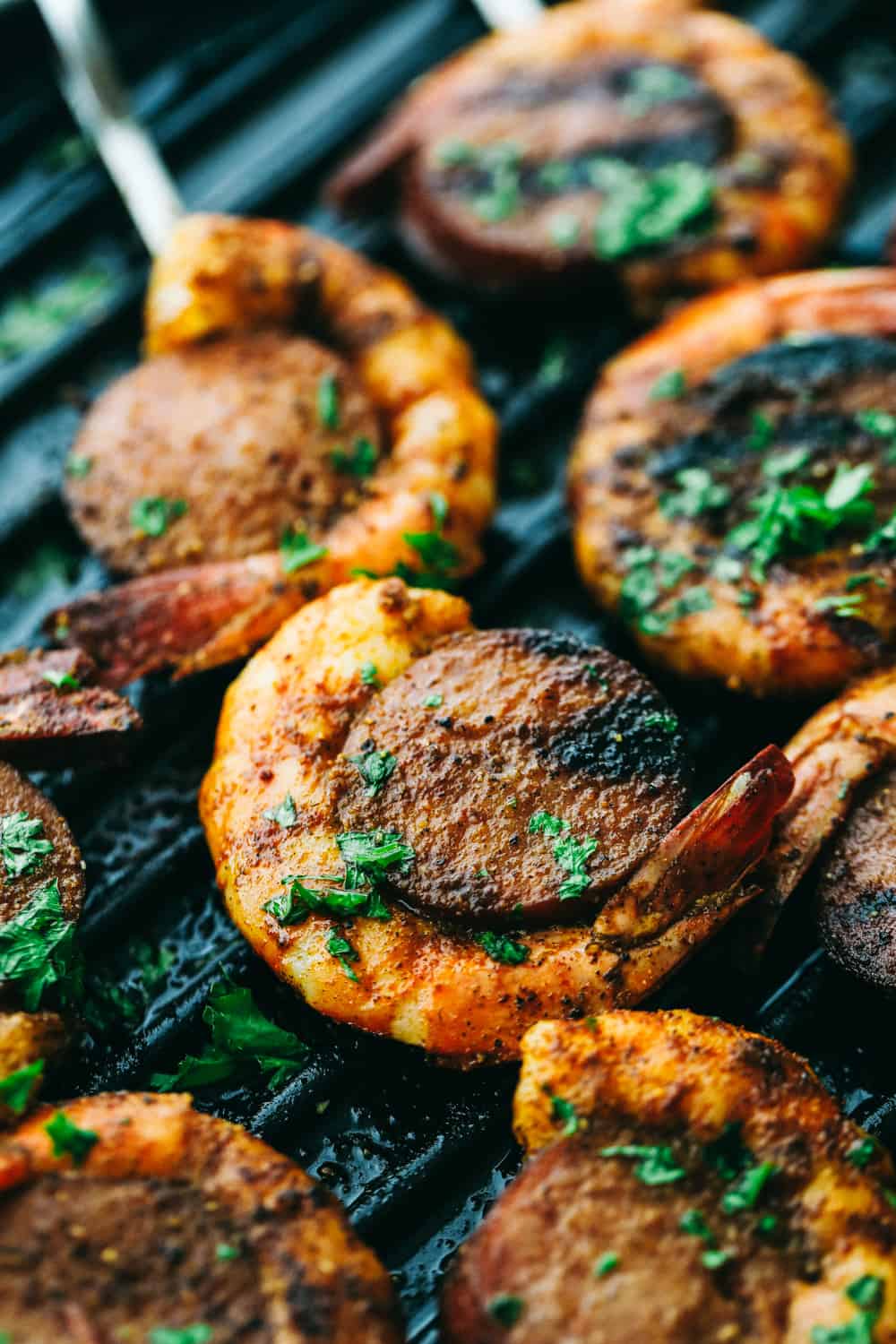 Easy and Amazing Cajun Shrimp and Sausage Skewers are simple to make and taste out of this world, good! Bold, flavorful Shrimp and Sausage make the perfect pairing on your next barbecue. Close up on Easy and Amazing Cajun Shrimp and Sausage Skewers