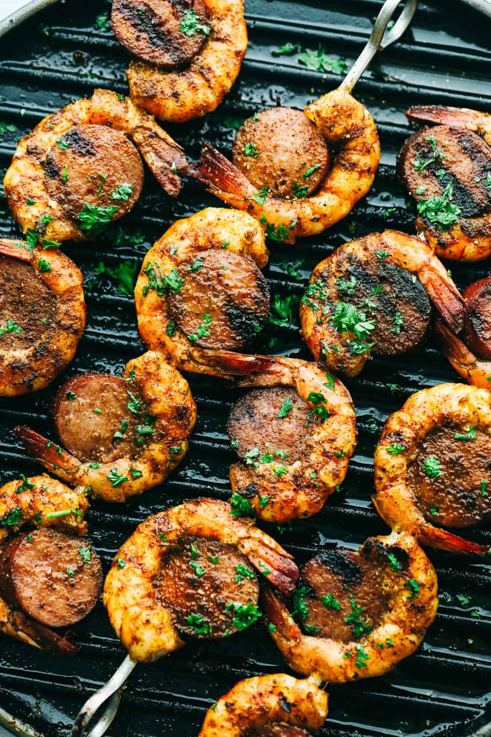 Easy and Amazing Cajun Shrimp and Sausage Skewers are simple to make and taste out of this world, good! Bold, flavorful Shrimp and Sausage make the perfect pairing on your next barbecue. Grilling Cajun Shrimp and Sausage Skewers