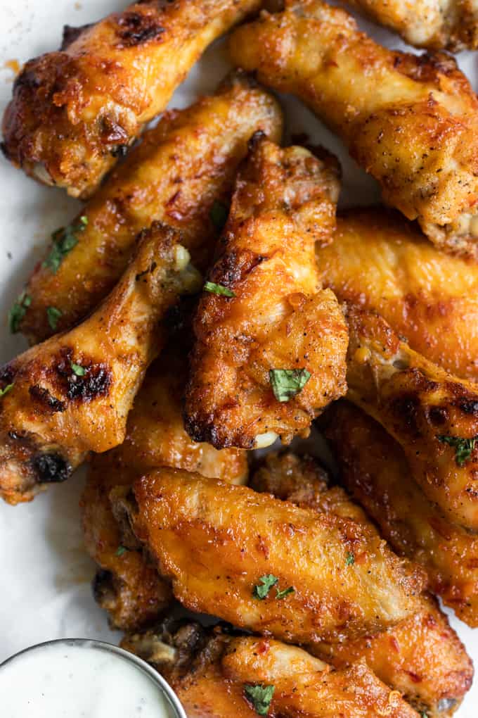 Chili Lime Chicken Wings. These BAKED chicken wings are simple to make and loaded with flavor thanks to a mixture of chili sauce and fresh lime juice and zest. The skin is so crispy on these you won't believe they aren't fried! Chili Lime Chicken Wings