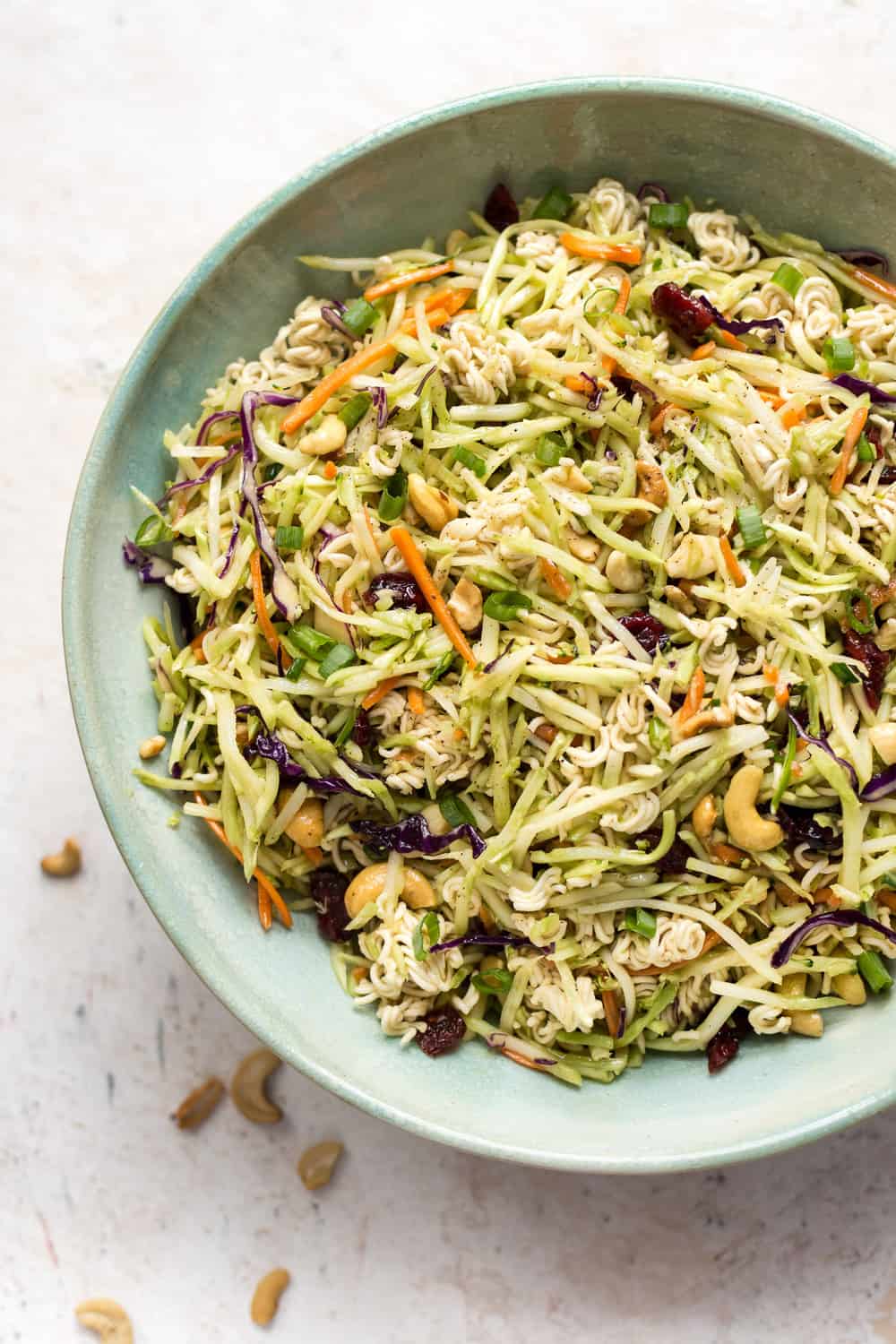 This Broccoli Ramen Salad is savory, sweet, and has the perfect amount of crunch! It's simple to make and has an addictive dressing. It'll be on repeat all summer! Broccoli Ramen Salad