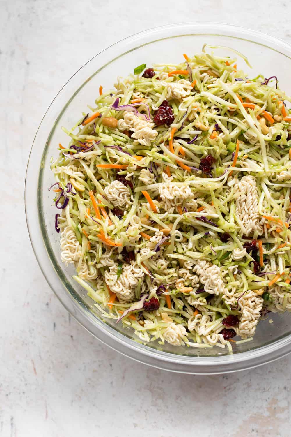 This Broccoli Ramen Salad is savory, sweet, and has the perfect amount of crunch! It's simple to make and has an addictive dressing. It'll be on repeat all summer! Broccoli Ramen Salad