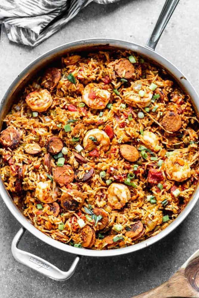 Thisย Easy Jambalaya Recipeย is packed with spicy andouille sausage, shredded chicken, sweet shrimp, and of course, plenty of vegetables and rice. Itโs the perfect one-pot meal for busy nights! Easy Jambalaya