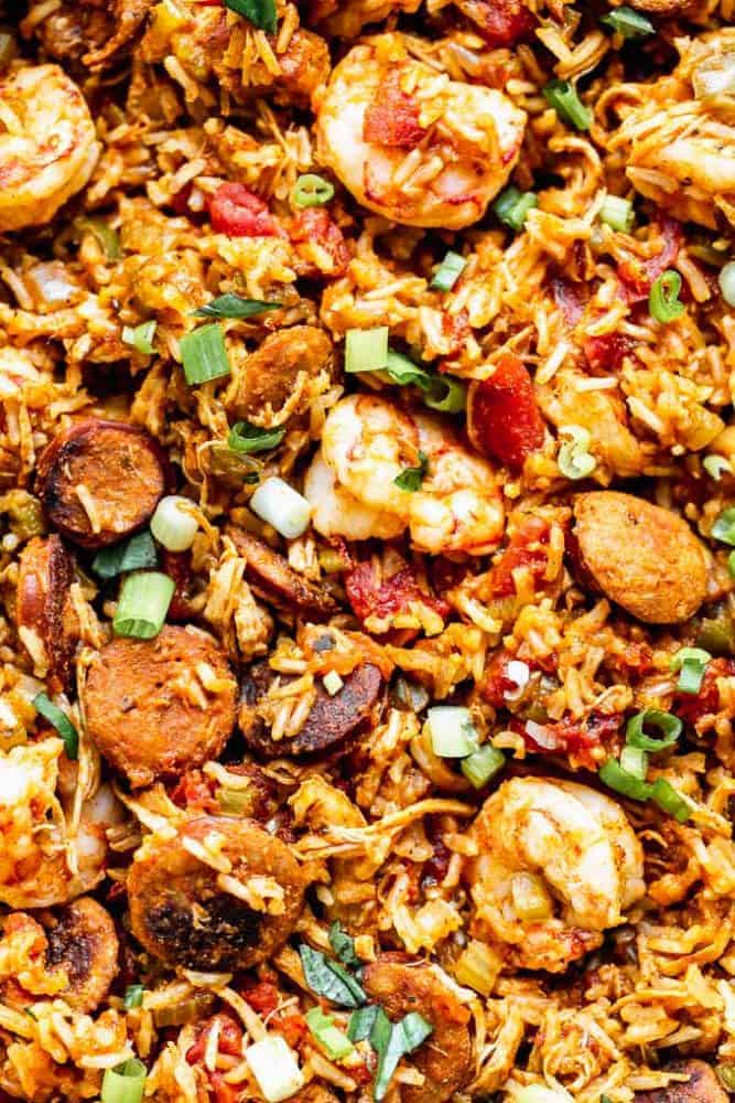 Thisย Easy Jambalaya Recipeย is packed with spicy andouille sausage, shredded chicken, sweet shrimp, and of course, plenty of vegetables and rice. Itโs the perfect one-pot meal for busy nights! easy jambalaya