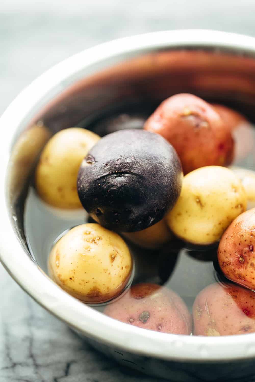German Potato Salad is a great alternative to the traditional American Potato Salad and has loads of flavour from a tangy, bacony dressing! Potatoes for German Potato Salad