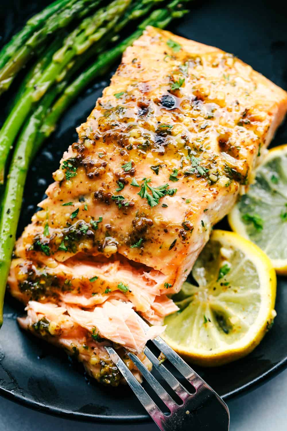 Honey Garlic Dijon Broiled Salmonย seasoned with herbs andย bย that comes together in just 15 minutes and literally has the best flavor ever! The best salmon of my life! Honey garlic dijon broiled salmon with asparagus