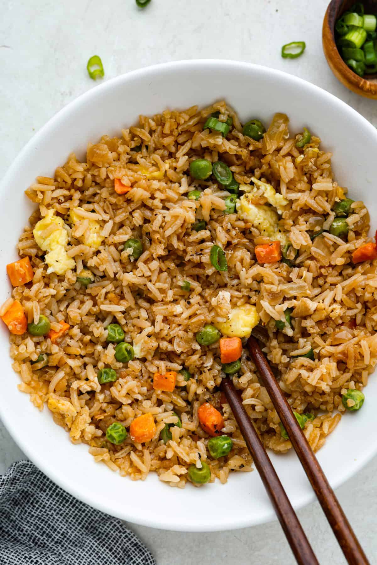 This Easy Fried Rice has always been one of the most-loved recipes on my site! I have different versions, but this classic is the one everyone keeps coming back to. Close up shot of a bowl of easy fried rice.