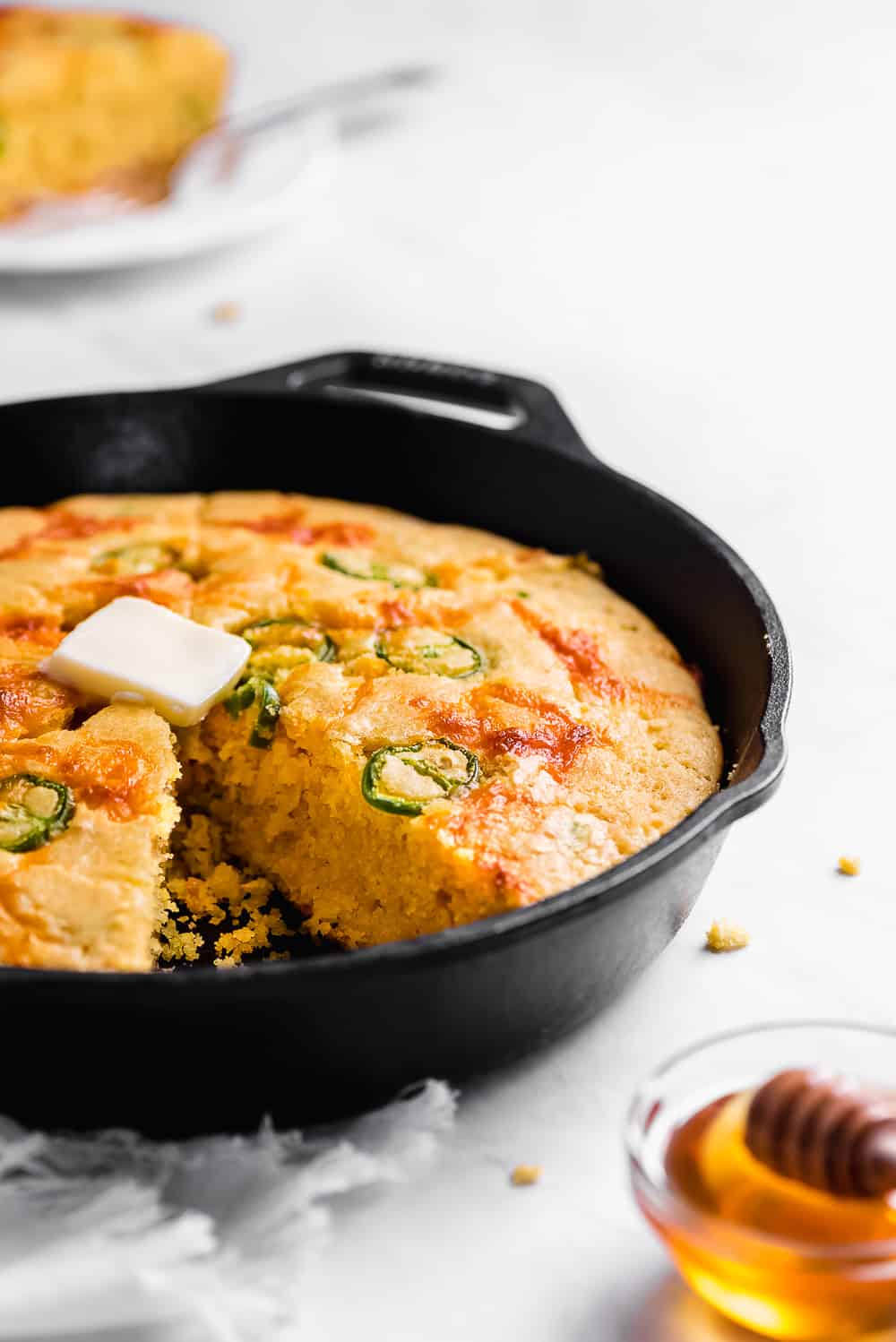 Jalapeño Cornbread is filled with spicy jalapeno peppers, cheddar cheese, and corn. This savory bread is moist, tender, and so easy to throw together. Serve it at your next barbecue or chili kick off! jalapeno cornbread