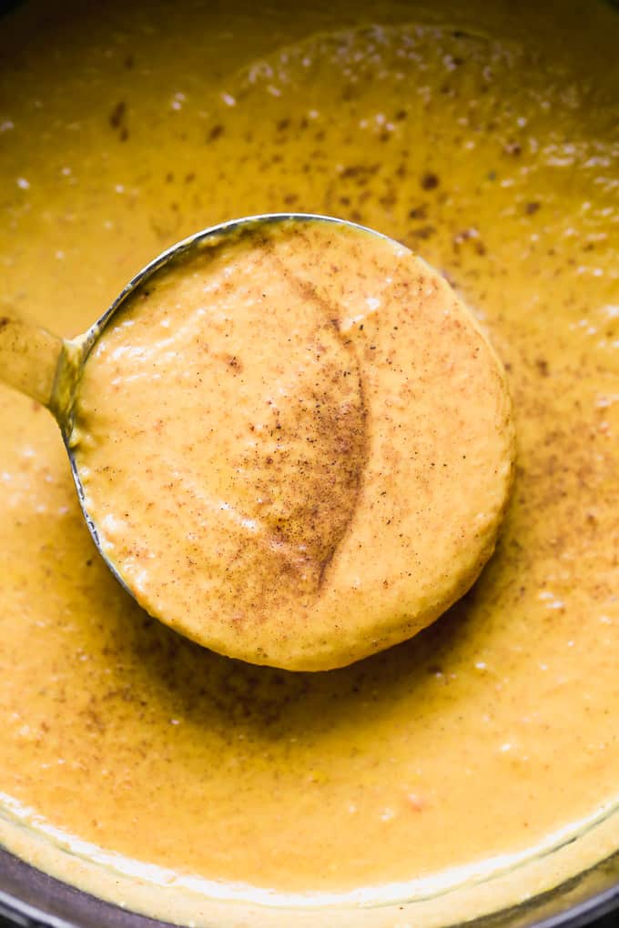 This Creamy Pumpkin Soup is packed with pumpkin flavor, a touch of sweetness, and velvety smooth. It's the perfect cozy fall soup, and it only takes 30 minutes to throw together! creamy pumpkin soup