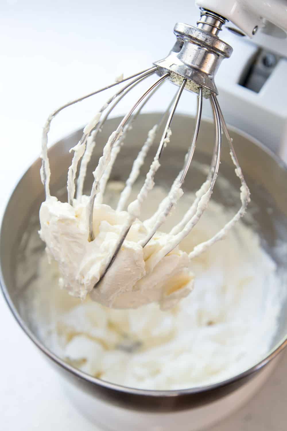 Red Velvet Cake Recipe is a classic must-have in your dessert arsenal. The super moist and slightly chocolaty cake, covered in a tangy cream cheese frosting, is the perfect way to end a great meal. Cream cheese frosting for red velvet cake recipe