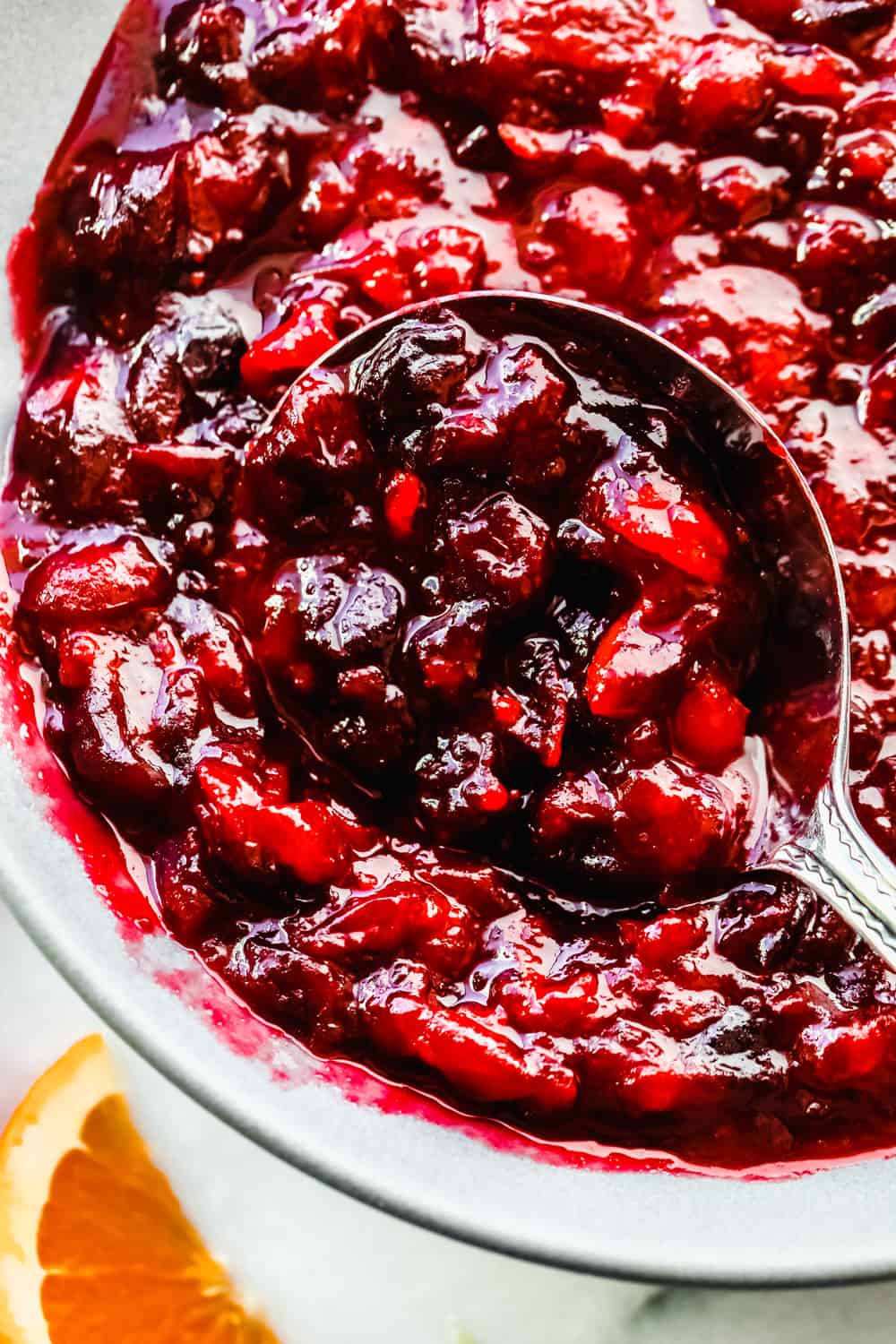 This cranberry sauce is the perfect mixture of sweet and tart! It's made with fresh cranberries and topped with orange zest to really set it apart! Up close cranberry sauce.