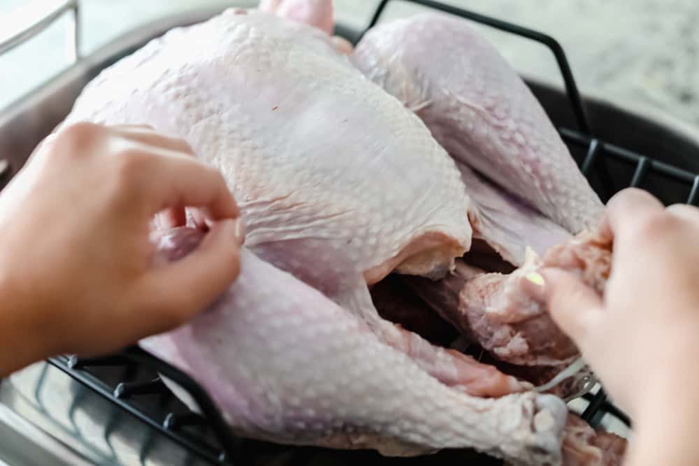 Turkey Brine creates aย tender, moist and juicy turkey withย sweet citrusy flavoring and a hint of spice all submerged in a water bath for your turkey to soak from the inside-out. Make your turkey irresistible this holiday season! preparing turkey to be brined