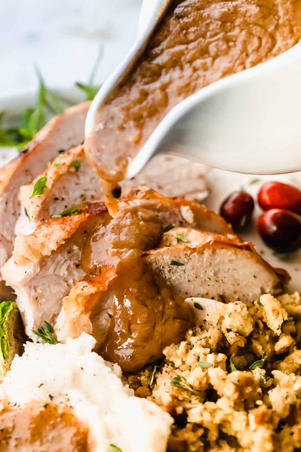 Rich, creamy, and ready in minutes, this turkey gravy is pure holiday comfort. Once you pour it over your turkey and mashed potatoes, you’ll never skip making it from scratch again. Pouring turkey gravy over the turkey