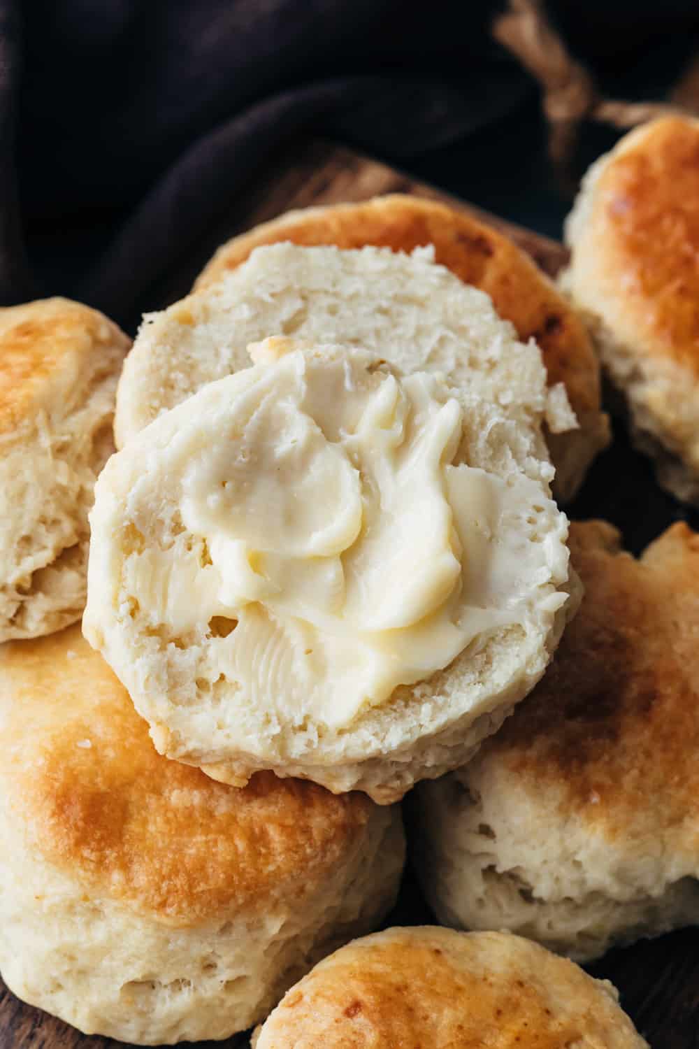 Delicious buttermilk biscuits are deceptively simple to make. They are flaky, melt in your mouth and you won't stop eating them. They stand tall and have the best layers.ย Butter slathered on buttermilk buscuits