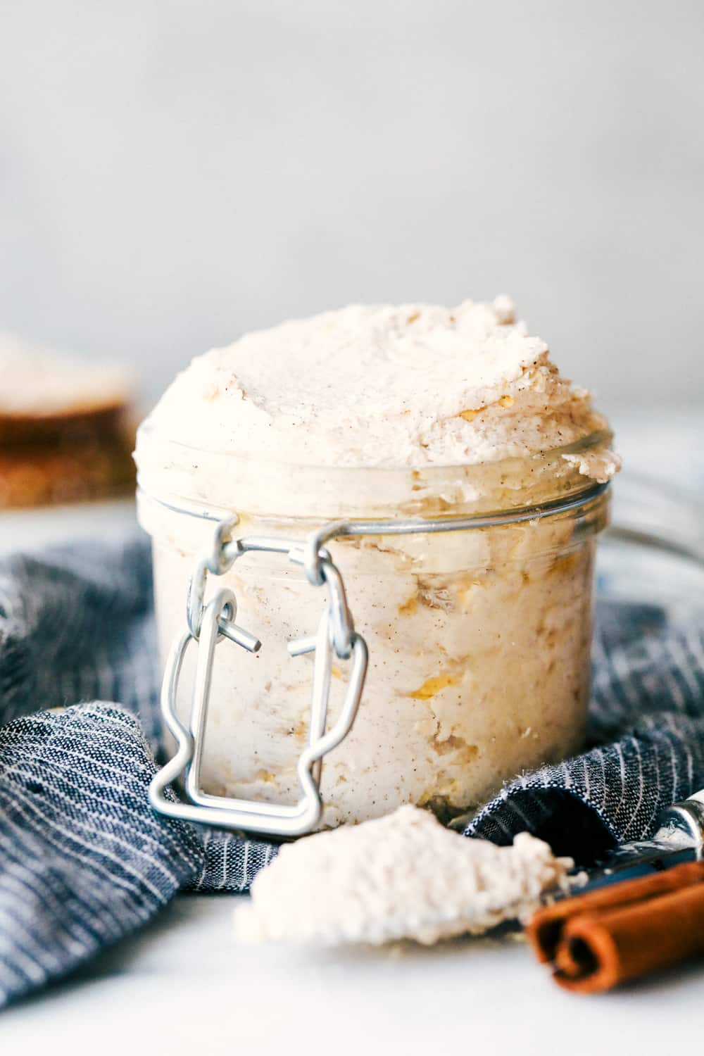 Maple Plant Butter (Three Ways!) is a smooth, creamy plant based butter that spreads perfectly over a piece of fresh bread and melts into all the cracks! You won't be able to live without it! maple plant butter in a jar