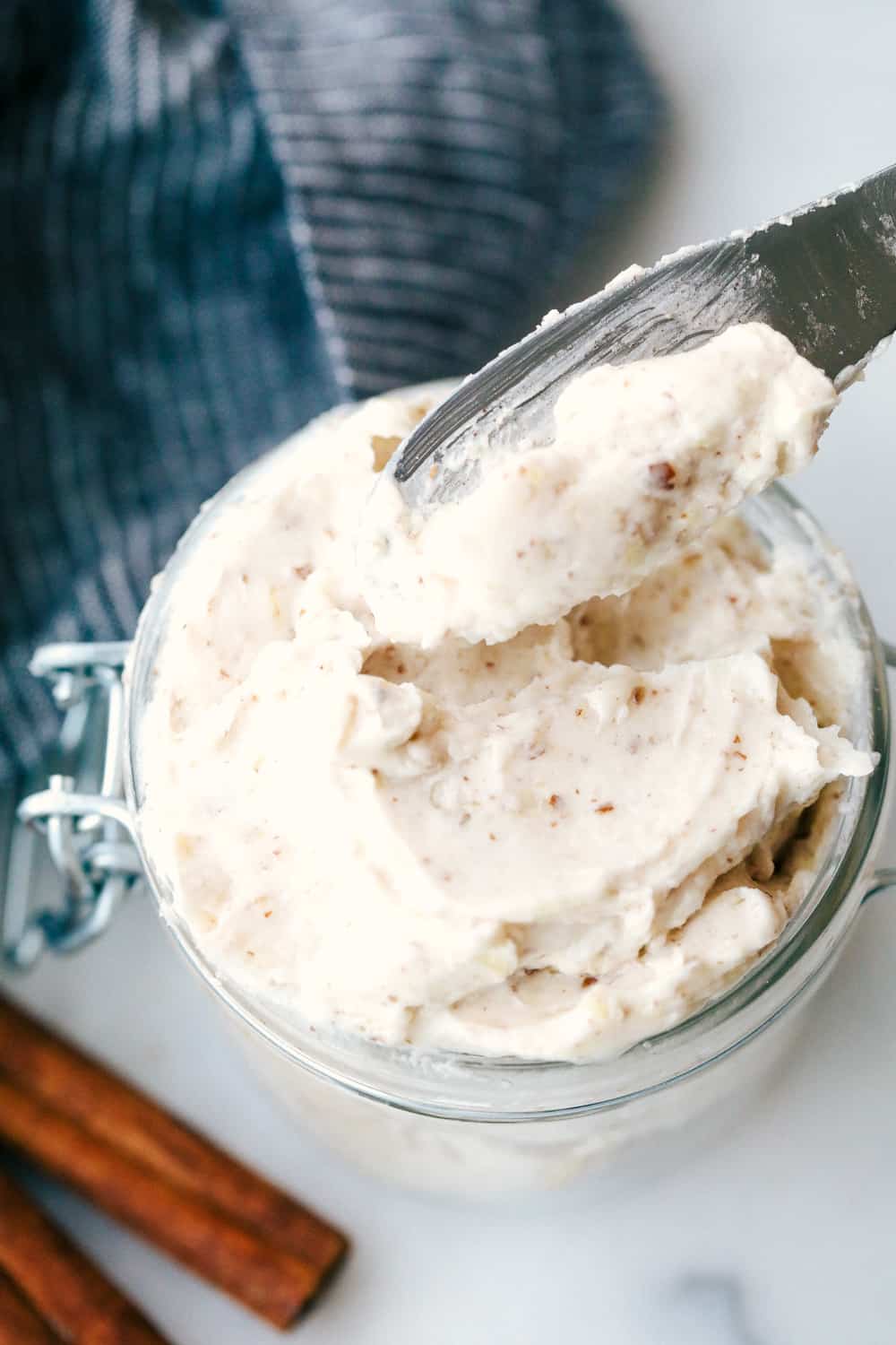 Maple Plant Butter (Three Ways!) is a smooth, creamy plant based butter that spreads perfectly over a piece of fresh bread and melts into all the cracks! You won't be able to live without it! Maple plant butter in a jar