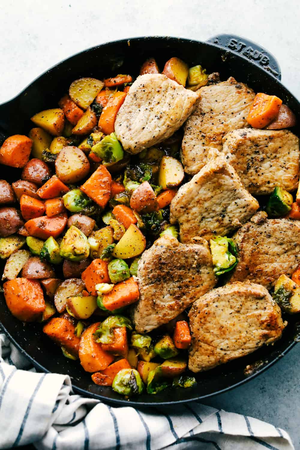 Skillet Pork Chops with Maple Dijon Vegetables is marinated Smithfield Steakhouse Mushroom Flavored Pork cut into pieces andย sautรฉed with tender vegetables covered with aย golden mapleย glaze. All under 30 minutes! skillet pork chops with maple dijon vegetables