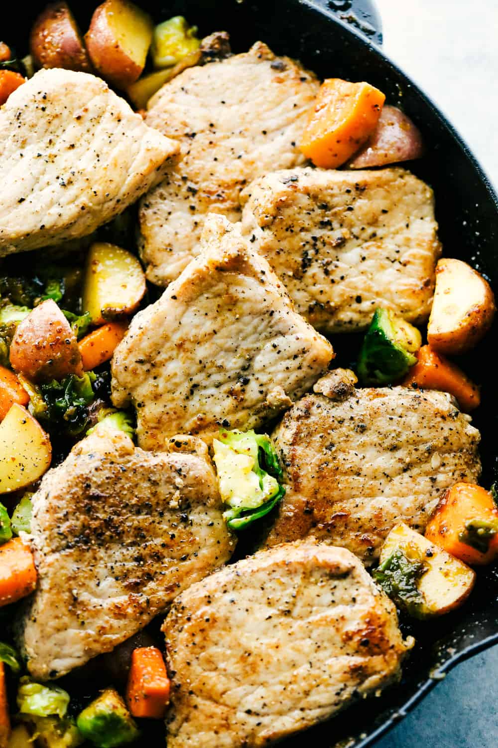 Skillet Pork Chops with Maple Dijon Vegetables is marinated Smithfield Steakhouse Mushroom Flavored Pork cut into pieces andย sautรฉed with tender vegetables covered with aย golden mapleย glaze. All under 30 minutes! skillet pork chops with maple dijon vegetables