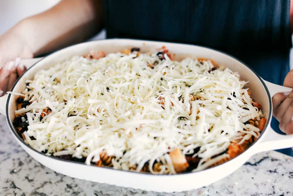 This Turkey Mediterranean Casserole features artichokes, fusilli pasta, sun dried tomatoes and Lindsay® Kalamata Olives baked in a red tomato sauce and topped with Lindsay® Chopped Black Olives. Simple, delicious ingredients in 30 minutes! Turkey Mediterranean casserole getting ready to be baked
