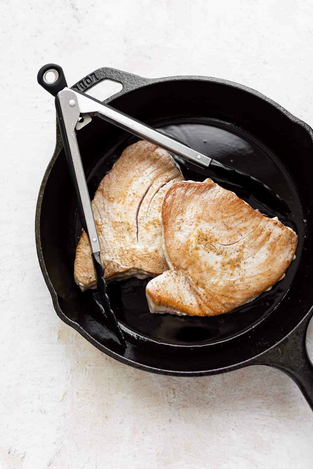 Ahi Tuna is a restaurant favorite that's easier to make at home than you think! It's quick and healthy - great for something a little different on a weeknight. ahi tuna in a skillet