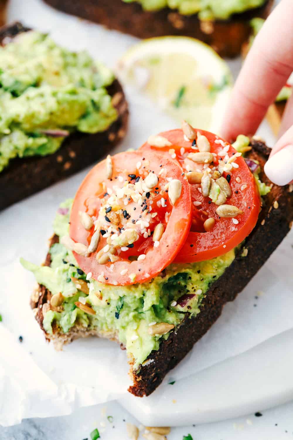 Easy 5 Minute Avocado Toastย is a toasted grain bread with ripe mashed avocados with variations of toppings to make each avocado toast unique and flavorful depending on the time of day. ย Perfect for aย quick breakfast, light lunch or snack! Avocado toast made with toasted bread, avocado mixture and tomato slices with everything bagel season.