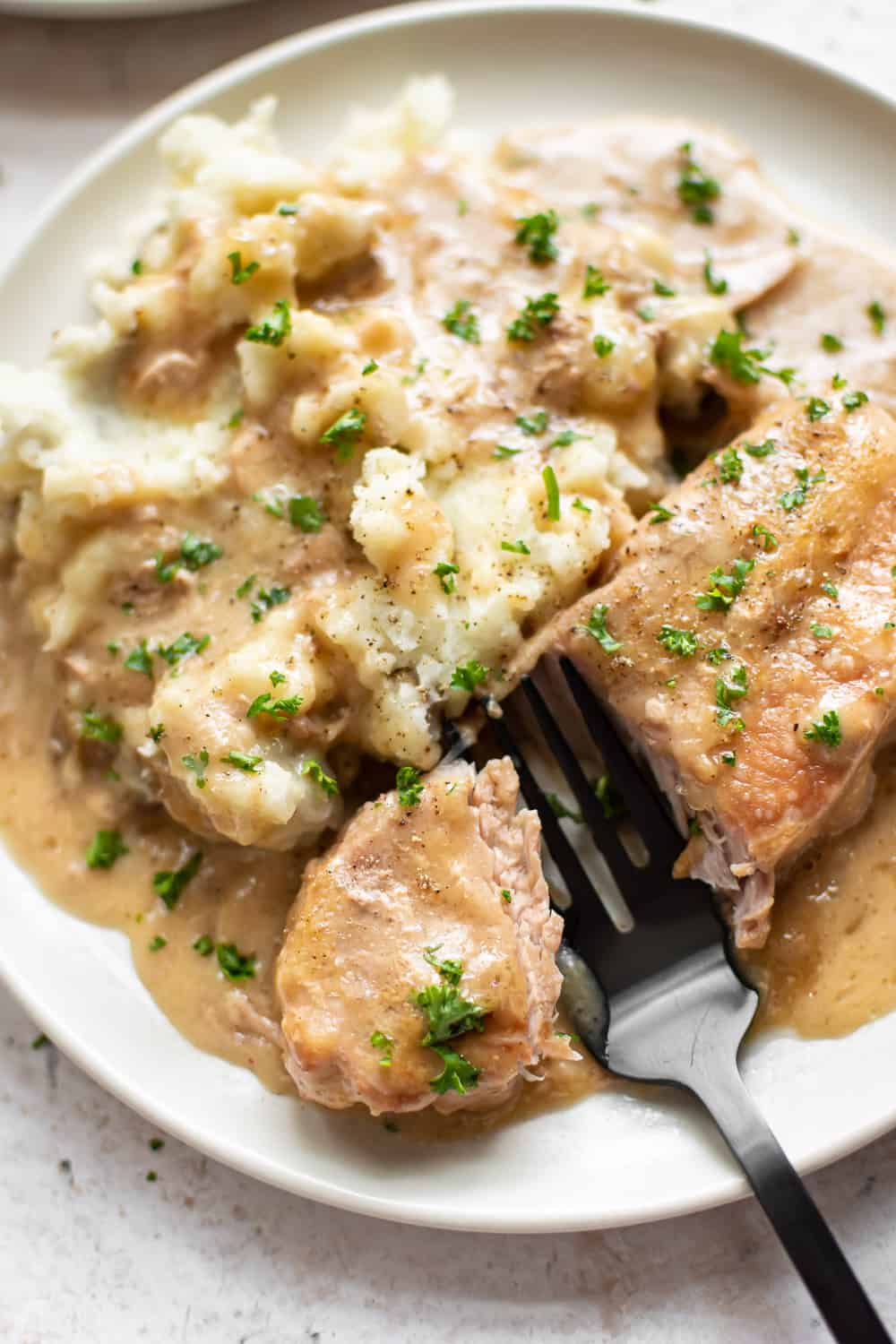 These Crock-Pot Pork Chops are fall-apart tender and ridiculously simple to make. The perfect comforting family meal! fall-apart tender Crock-Pot pork chops