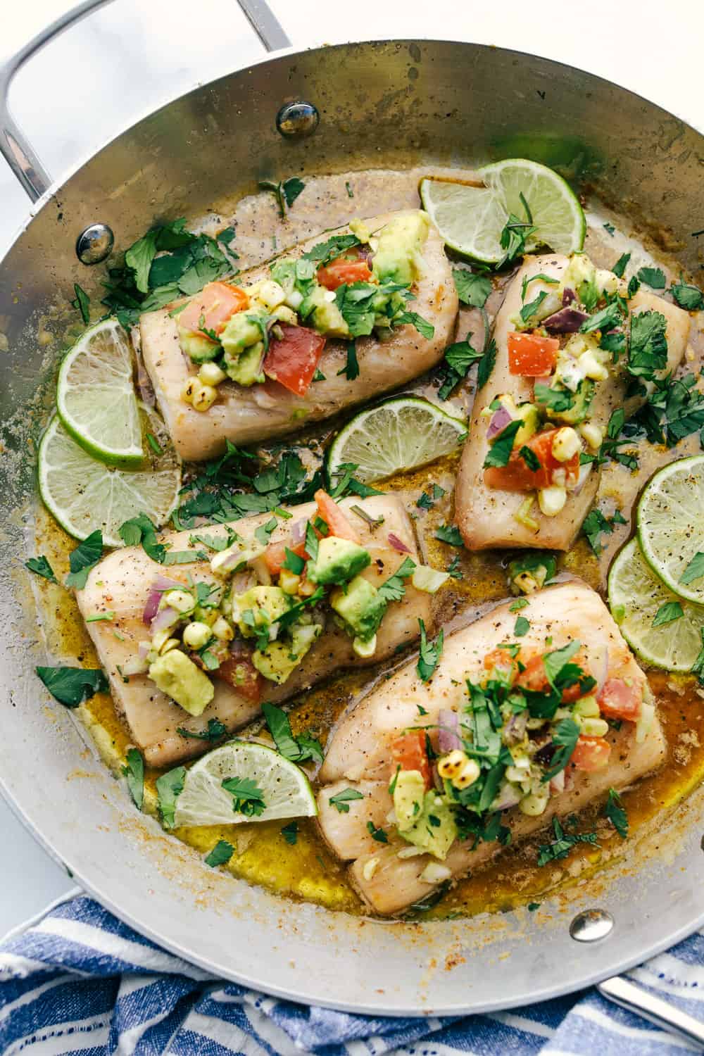 Mahi Mahi is aย tender filet cooked golden brown then in soaked in a brown butter sauce and garnished with a fresh avocado salsa. Anย irresistible Dinner! Mahi Mahi filets cooked in a skillet with brown butter and garnished with avocado on top.