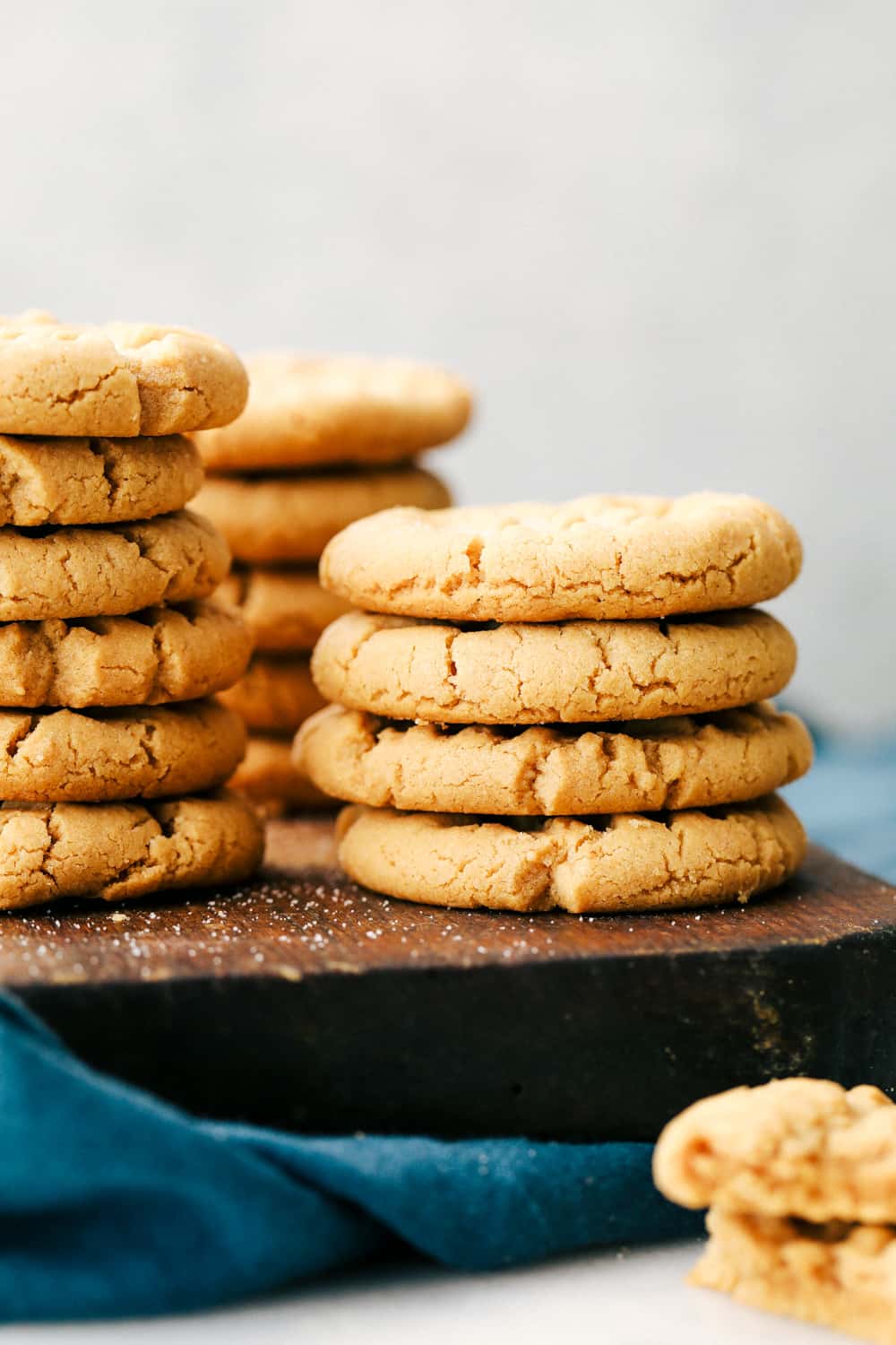 These homemade cookiesย are soft, fluffy and full ofย creamy peanut butter, and it only takes 3 ingredients to make them! Peanut butter cookies stacked on top of each other.