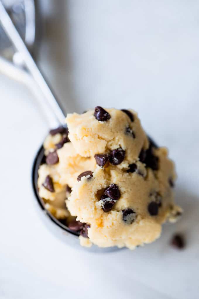 This edible cookie dough will definitely hit the spot. No need to steal those risky bites of cookie dough anymore, make an entire bowl of this safe to eat cookie dough! Edible cookie dough scooped in a 1 in cookie scooper.