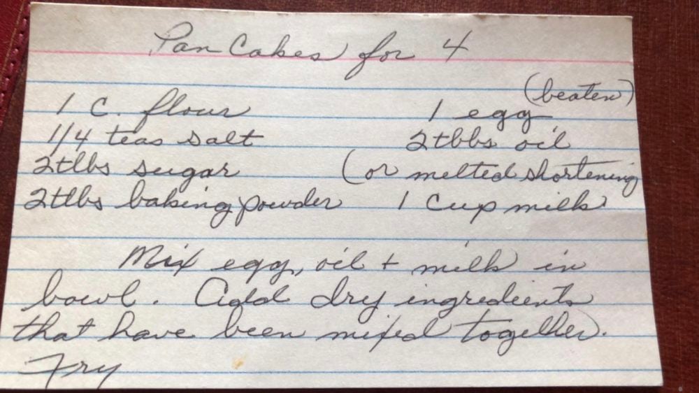 Grandma's homemade fluffy pancakes are the ultimate comfort breakfast! They're light and airy, yet satisfyingly filling, making them the perfect morning treat. Grandma's recipe card with ingredients she wrote by hand.