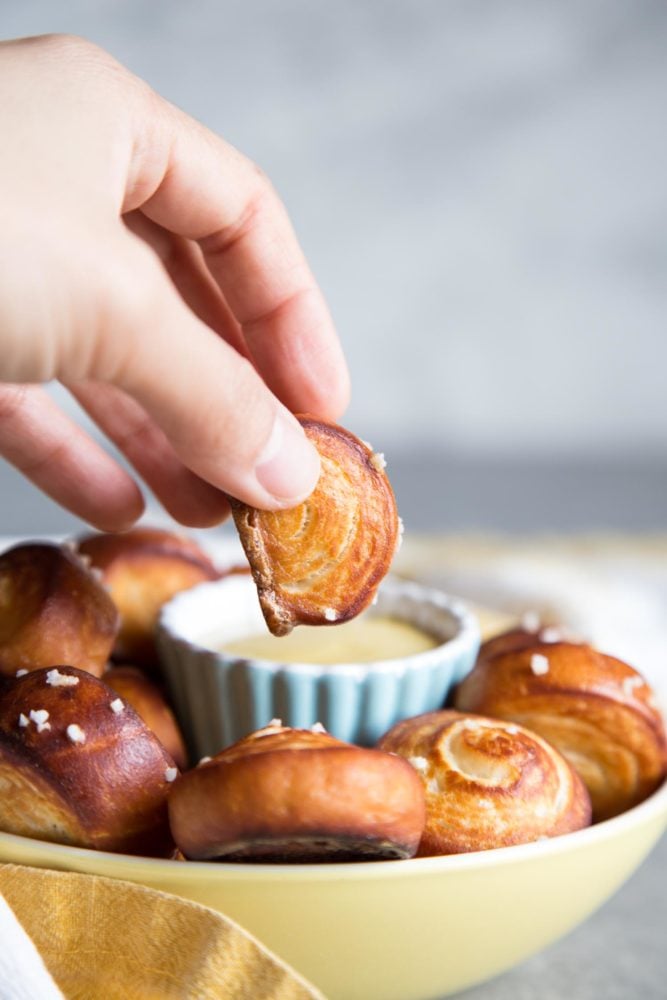 Pretzel Bites are the perfect afterschool snacks, game day appetizers, and popcorn replacement for movie nights. The outside of each pretzel bites is golden brown and chewy, while the inside is soft and fluffy. Dipping a pretzel bite into mustard sauce