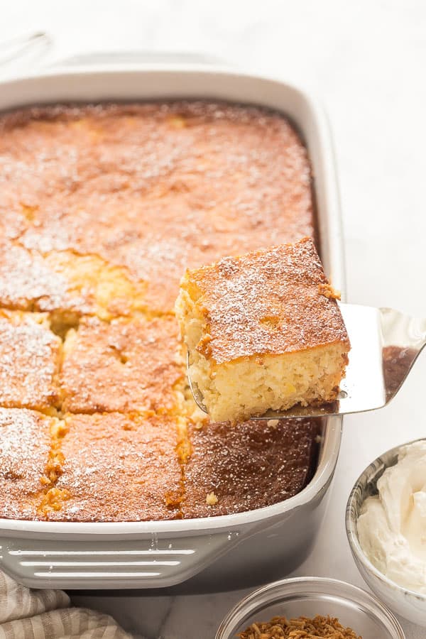 This Pineapple Cake recipe is made from scratch with crushed pineapple and topped with cream cheese whipped cream for a light but decadent treat! #pineapple #cake #baking #dessert pineapple cake whole