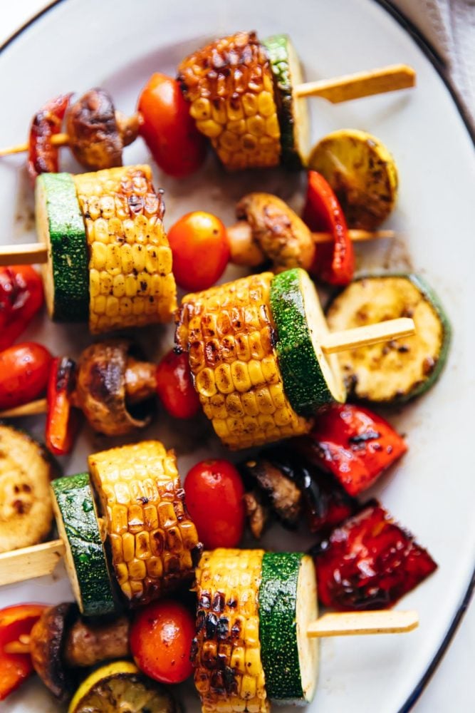 Grilled Vegetable Kabobs are tossed in a spicy lemony marinade and grilled till lightly charred. They soak up all the flavour and become juicy, tender but remain slightly crunchy. Grilled vegetable kabobs served on a platter
