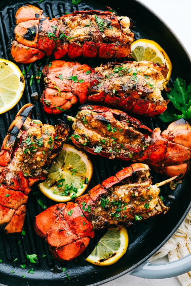Grilled Cajun Garlic Butter Lobster Tails are buttery and savory and they make a normal night at home seem so fancy! To elevate your next dinner party be sure to include these in your plans! Lobster tail on grill pan.