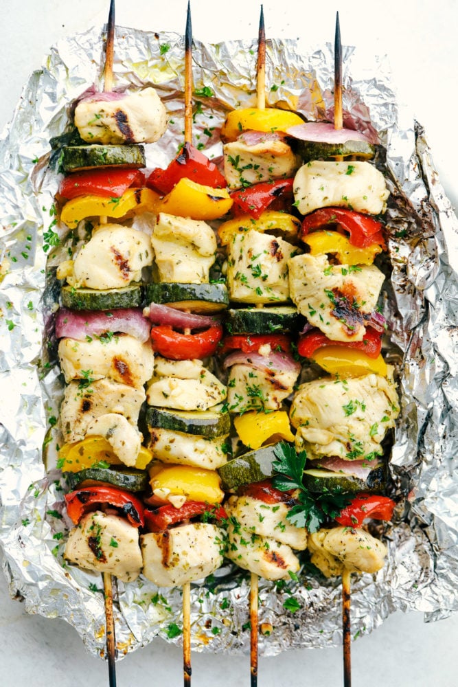 Garlic Ranch Chicken Skewers are the perfect way to enjoy kabobs this summer. Get grilling with this easy to make chicken that has all the flavor on each skewer! Chicken skewers wrapped in foil.
