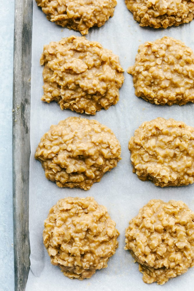 Peanut Butter No Bake Cookies are an easy to make family favorite dessert.ย They are loaded with peanut butter flavor and an addictive chewy texture you won't be able to get enough of!ย No bake cookies cooling on the baking sheet.