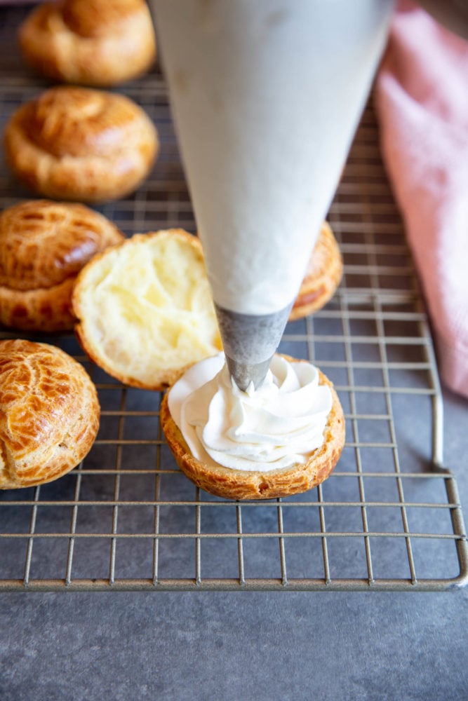 Cream puffs filled with simple vanilla whipped cream and covered in a dusting of powdered sugar are a classic dessert. But once youโve mastered the recipe for the cream puff shell, it can be customized with all sorts of delicious filling to your heartโs desire! Adding whipped cream filling to cream puffs