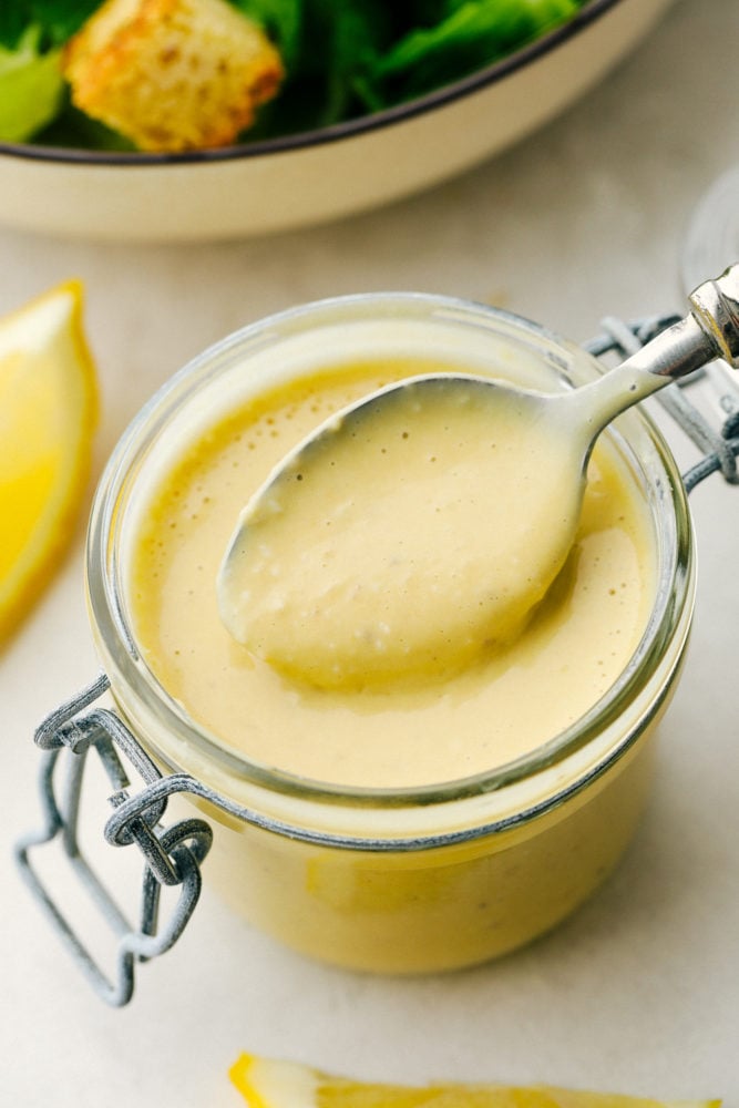 Authentic Caesar Dressing is rich creamy and so much better homemade than from a jar. You are going to love how simple this really is and the savory flavor is going to WOW you! It will Change the way you eat anything Caesar forever! Rich and Creamy Authentic Caesar Dressing.