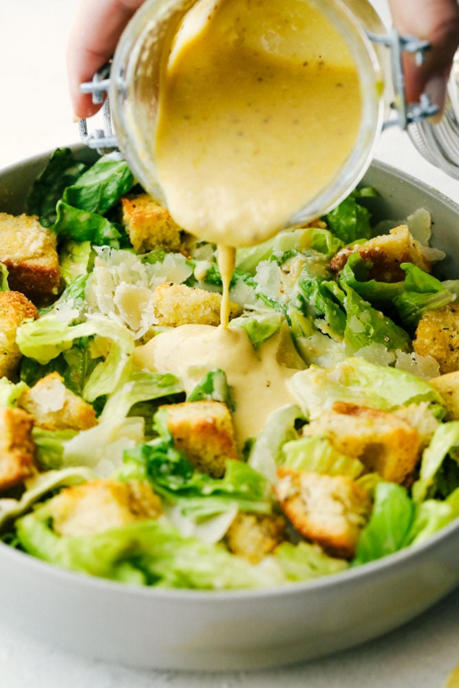 Authentic Caesar Dressing is rich creamy and so much better homemade than from a jar. You are going to love how simple this really is and the savory flavor is going to WOW you! It will Change the way you eat anything Caesar forever! Rich and Creamy Authentic Caesar Dressing.