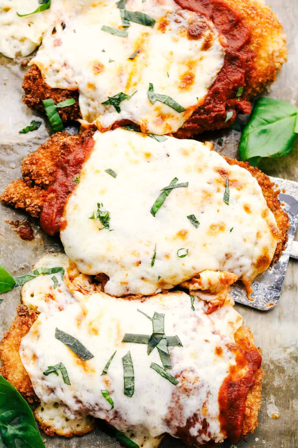 Sharing my best Chicken Parmesan recipe with you today with tender, juicy chicken that is full of flavor and a ย dinner everyone will love! Chicken parmesan with marinara and melted cheese.