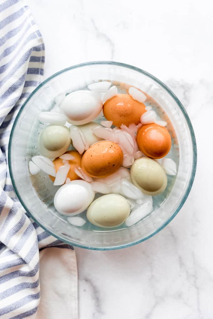 Instant Pot Hard Boiled Eggs are hands down the best thing to make in your electric pressure cooker! Not only do they turn out perfect every time, but they peel better than any other method! Hard boiled eggs in an ice water bath.