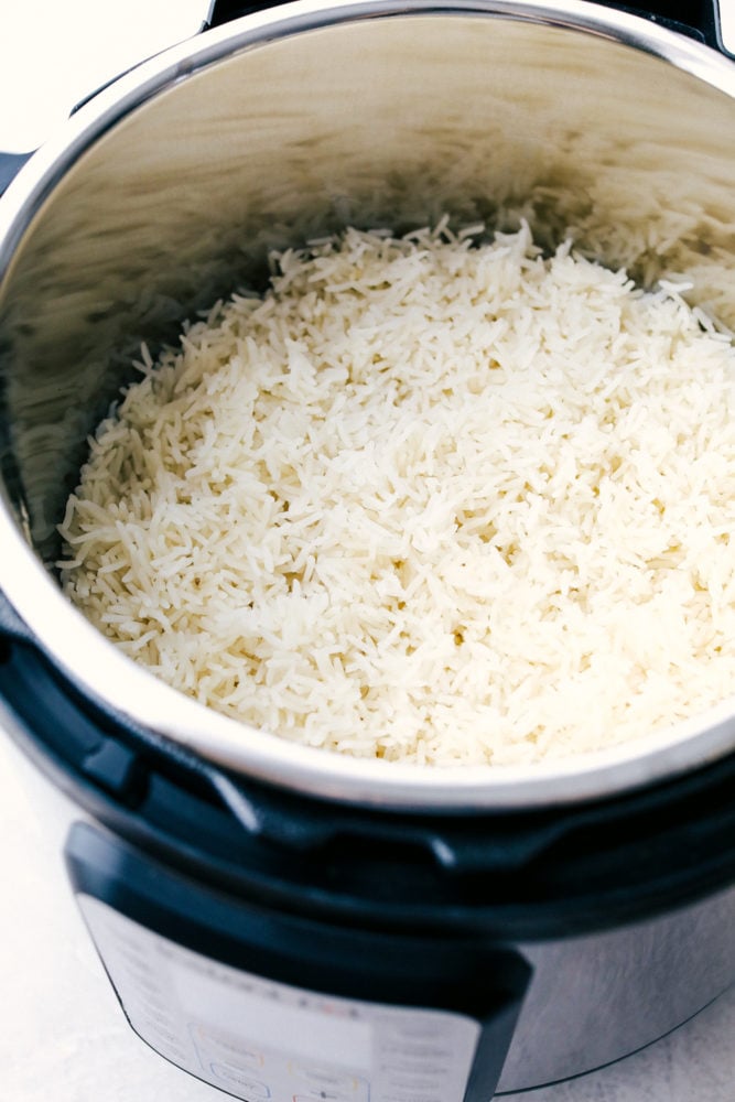 Instant pot rice is perfectly fluffy, light, tender and never sticky.ย When you use your Instant pot it's perfect EVERY SINGLE TIME! Even your tricky hard to master brown and wild rice will be perfect. It's so easy you'll never use a pot on the stove again. Perfect fluffy light tender Instant pot rice.