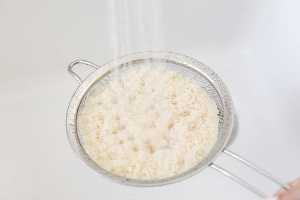 Instant pot rice is perfectly fluffy, light, tender and never sticky.ย When you use your Instant pot it's perfect EVERY SINGLE TIME! Even your tricky hard to master brown and wild rice will be perfect. It's so easy you'll never use a pot on the stove again. Rinsing Rice before cooking.