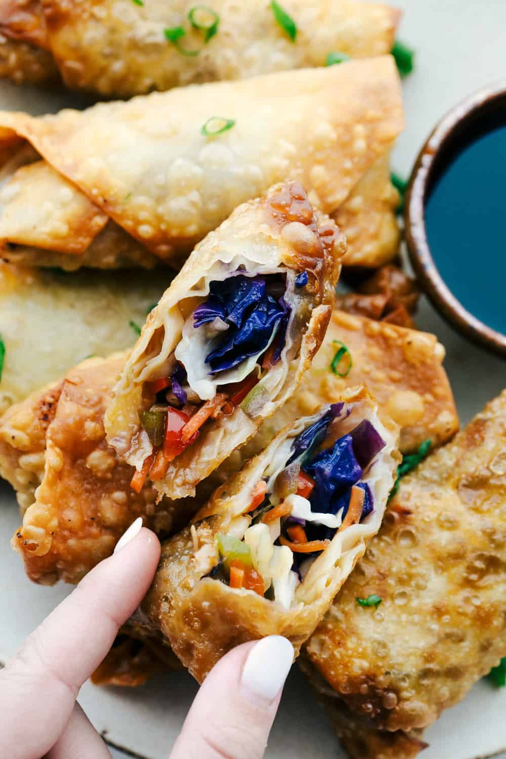 Vegetable Egg rolls are filled with colorful, crunchy flavorful veggies and fried till golden crispy brown. These are a homemade take on a classic take out favorite. Super easy and so delectable you'll never buy them again!ย Vegetable Egg Rolls, crispy colorful crunchy veggies fried to perfection.