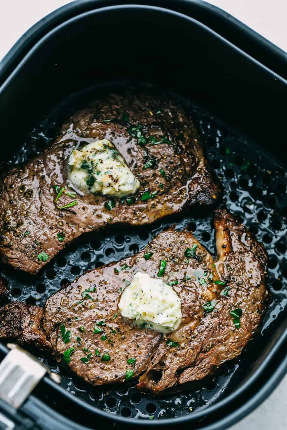 My Air Fryer Steak is a favorite around here for a reason! Itโs perfectly seared, super juicy, and so full of flavorโitโs my go-to way to make steak! Perfect Air Fryer Steak with golden seared outside and tender juicy inside. Topped with garlic butter.