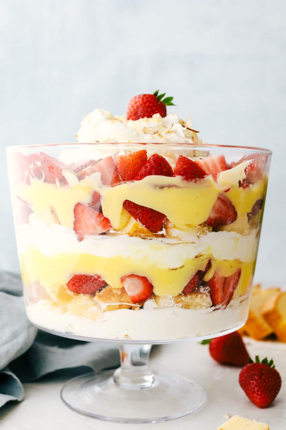 Easy English Trifle is a light, delectable, sweet treat. It's so easy and so delicate and beautiful. Make sure you spotlight this fanciful dessert in a clear bowl, for all to see it's luscious layers. The English trifle in a tall glass dish layered together.