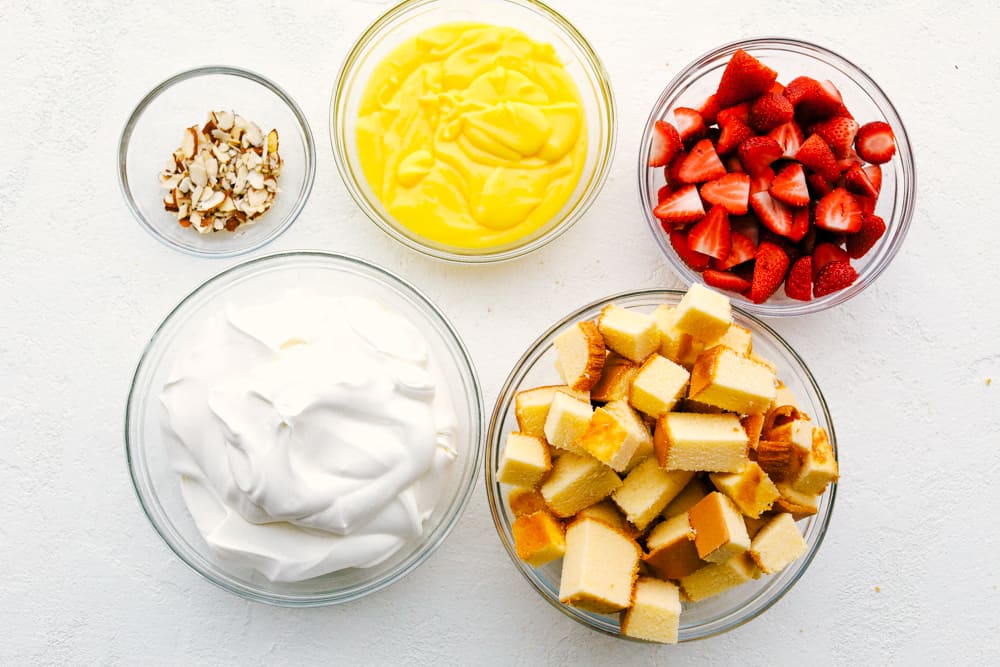 Easy English Trifle is a light, delectable, sweet treat. It's so easy and so delicate and beautiful. Make sure you spotlight this fanciful dessert in a clear bowl, for all to see it's luscious layers. Glass bowls with all the ingredients.