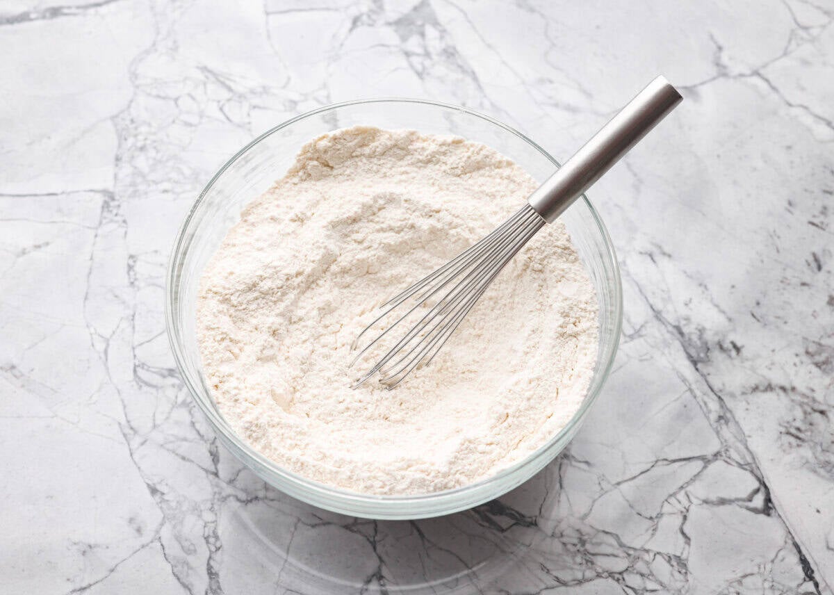 My Homemade Pancake Mix uses 4 pantry staple ingredients and only takes 5 minutes to make! Ditch the box and make this simple mix for fluffy, delicate pancakes anytime! Ingredients mixed together.