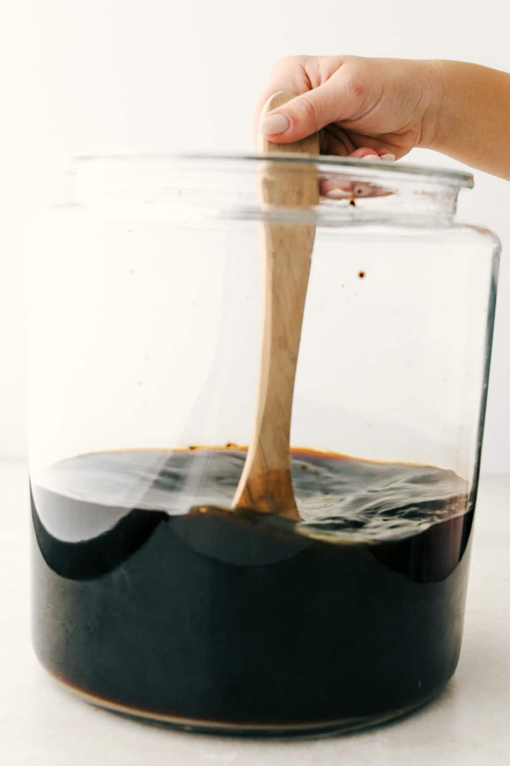 This Homemade Root Beer is a fun, sweet, refreshing treat to make any occasion extra special. It takes just 4 ingredients to create a little magic and a whole lot of tasty fun! ย Stirring up the mixture till dissolved.